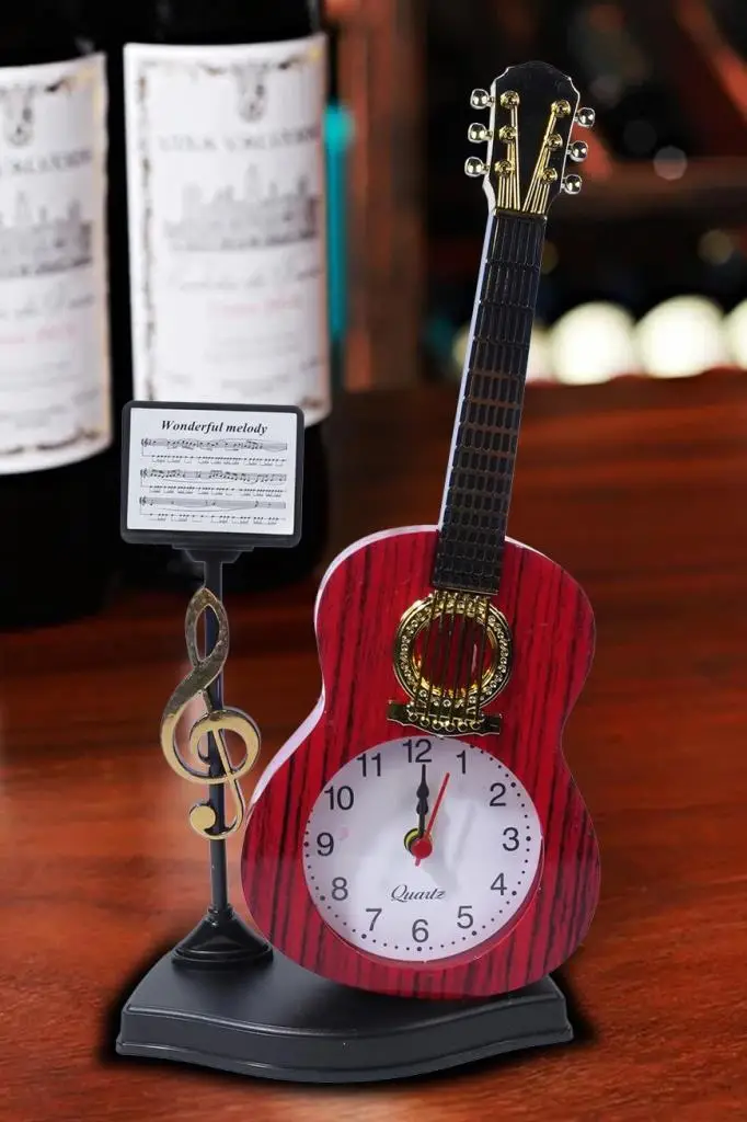 https://www.yonkamuzikmarket.com/rennes-gitar-gorunumlu-dekoratif-masa-susu-oda-susu-biblo-22x13cm-rgv-b42yn